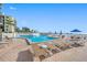 Relaxing community pool with lounge chairs and beach access at 5396 Gulf Blvd # 605, St Pete Beach, FL 33706