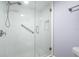 Shower with white tile and glass enclosure at 5396 Gulf Blvd # 605, St Pete Beach, FL 33706