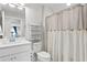 Clean bathroom with toilet, sink, and shower/tub combo at 5519 Blue Crush Bnd, Land O Lakes, FL 34638