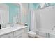Bright bathroom with a bathtub, toilet and vanity at 5519 Blue Crush Bnd, Land O Lakes, FL 34638