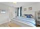 Spacious bedroom with king-size bed, ensuite bathroom access, and calming decor at 5519 Blue Crush Bnd, Land O Lakes, FL 34638