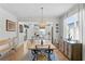 Open concept dining room with kitchen and access to backyard at 5519 Blue Crush Bnd, Land O Lakes, FL 34638