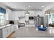 Modern kitchen with stainless steel appliances and white shaker cabinets at 5519 Blue Crush Bnd, Land O Lakes, FL 34638