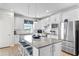 Modern kitchen with white cabinets, gray countertops, and stainless steel appliances at 5519 Blue Crush Bnd, Land O Lakes, FL 34638