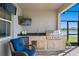 Stainless steel outdoor kitchen with seating for one at 5519 Blue Crush Bnd, Land O Lakes, FL 34638
