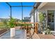 Bar and seating area on a screened patio at 5519 Blue Crush Bnd, Land O Lakes, FL 34638