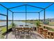 Screened patio with lake view and outdoor bar at 5519 Blue Crush Bnd, Land O Lakes, FL 34638