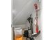Small storage closet with shelving and cleaning supplies at 5519 Blue Crush Bnd, Land O Lakes, FL 34638