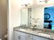 Double vanity bathroom with granite countertop and large mirror at 5980 Central Ave, New Port Richey, FL 34653