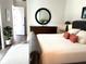 Bright bedroom with a comfortable bed and dresser at 5980 Central Ave, New Port Richey, FL 34653