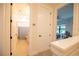 Bright hallway with access to bedrooms and bathrooms at 5980 Central Ave, New Port Richey, FL 34653