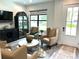 Bright living room with comfy seating and a view at 5980 Central Ave, New Port Richey, FL 34653