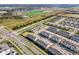 This aerial captures beautiful townhomes, offering views of community amenities and nearby roadways at 6324 Camino Dr, Apollo Beach, FL 33572
