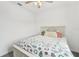 Charming bedroom featuring a cozy bed with decorative throw and neutral color scheme at 6324 Camino Dr, Apollo Beach, FL 33572