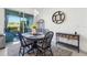 Charming dining area with stylish decor and a sliding glass door to the exterior at 6324 Camino Dr, Apollo Beach, FL 33572