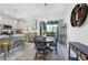 Inviting dining area adjacent to the kitchen, featuring a modern table set and sliding glass doors at 6324 Camino Dr, Apollo Beach, FL 33572