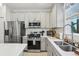 Contemporary kitchen featuring stainless steel appliances, subway tile backsplash, and plenty of counter space at 6324 Camino Dr, Apollo Beach, FL 33572