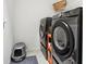 Functional laundry area with modern washer and dryer, plus convenient shelving at 6324 Camino Dr, Apollo Beach, FL 33572