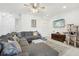 Bright and spacious living room with tile floors and access to the staircase at 6324 Camino Dr, Apollo Beach, FL 33572