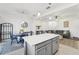 Inviting open-concept living space with kitchen island, dining area, and comfortable seating arrangement at 6324 Camino Dr, Apollo Beach, FL 33572