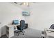 Bright office space with desk, ample storage, and neutral walls; ideal for productivity at 6324 Camino Dr, Apollo Beach, FL 33572