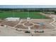 Aerial view of a construction site showing new sports fields and surrounding infrastructure at 6324 Camino Dr, Apollo Beach, FL 33572