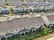 This aerial showcases lovely townhomes with cozy screened patios and manicured greenery at 6324 Camino Dr, Apollo Beach, FL 33572