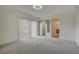 Bedroom with mirrored closet and access to bathroom at 721 1St Ct, Palm Harbor, FL 34684