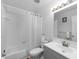 Clean bathroom with a tub, shower, and gray vanity at 7240 E Bank Dr # 204, Tampa, FL 33617