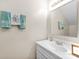 Clean bathroom with white vanity and mirror at 7240 E Bank Dr # 204, Tampa, FL 33617
