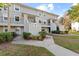 Building exterior during the day, showing multiple units and landscaping at 7240 E Bank Dr # 204, Tampa, FL 33617