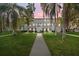 Building exterior at dusk, showcasing landscaping and walkway at 7240 E Bank Dr # 204, Tampa, FL 33617