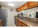 Modern kitchen with stainless steel appliances and granite countertops at 7240 E Bank Dr # 204, Tampa, FL 33617