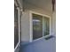 Sliding glass door opens to a back patio with a screened enclosure at 727 Winterside Dr, Apollo Beach, FL 33572
