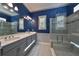 Modern bathroom with a double vanity and walk-in shower at 727 Winterside Dr, Apollo Beach, FL 33572