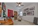 Bedroom with a wooden desk, chair, and shelves at 727 Winterside Dr, Apollo Beach, FL 33572