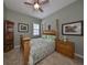 Bedroom with a wooden bed frame and a ceiling fan at 727 Winterside Dr, Apollo Beach, FL 33572