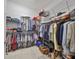 Large walk-in closet with ample hanging space and shelving at 727 Winterside Dr, Apollo Beach, FL 33572