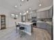 Modern kitchen with island and stainless steel appliances at 727 Winterside Dr, Apollo Beach, FL 33572