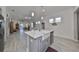 Open concept kitchen with island and breakfast bar at 727 Winterside Dr, Apollo Beach, FL 33572
