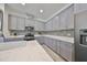 Modern kitchen with gray cabinets and quartz countertops at 727 Winterside Dr, Apollo Beach, FL 33572