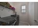 Convenient laundry room with washer, dryer, and shelving at 727 Winterside Dr, Apollo Beach, FL 33572