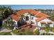 A beautiful white home with red tile roof and lush landscaping at 751 34Th Ne Ave, St Petersburg, FL 33704