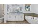 Spa-like bathroom with soaking tub and double vanity at 751 34Th Ne Ave, St Petersburg, FL 33704