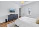 Modern bedroom with a dresser, TV, and hardwood floors at 751 34Th Ne Ave, St Petersburg, FL 33704