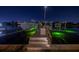 Night view of a boat on a dock with green underwater lighting at 751 34Th Ne Ave, St Petersburg, FL 33704