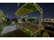 Night view of a boat dock with a bar and seating area at 751 34Th Ne Ave, St Petersburg, FL 33704