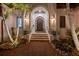 Elegant entryway with arched doorway, lanterns, and brick walkway at 751 34Th Ne Ave, St Petersburg, FL 33704