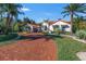 Mediterranean home with a red brick driveway and lush landscaping at 751 34Th Ne Ave, St Petersburg, FL 33704