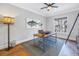 Home office with large window, hardwood floors, and built-in shelves at 751 34Th Ne Ave, St Petersburg, FL 33704